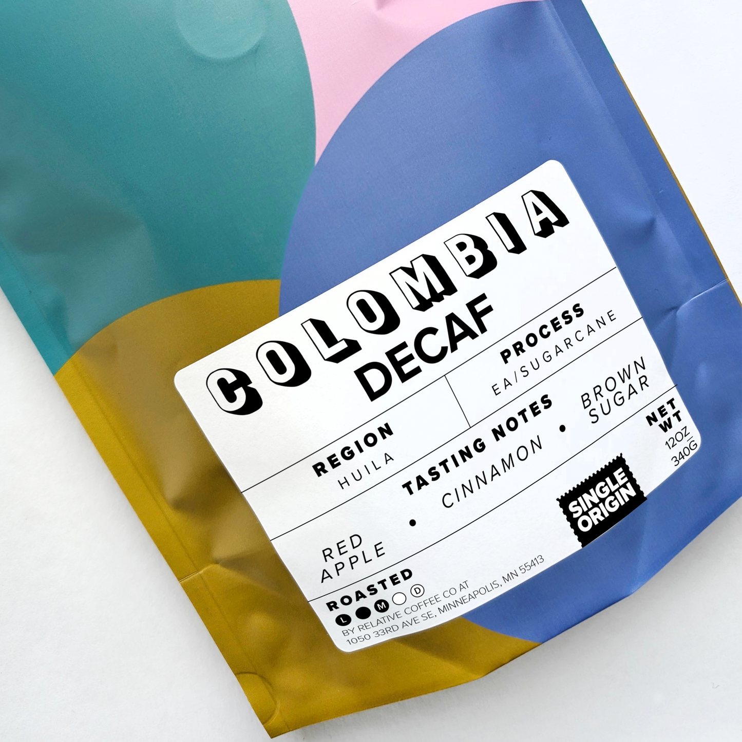 Picture of coffee bag that shows it is a decaf coffee from Colombia. It is from the region of Huila. The process of this coffee is EA or sugarcane process. The coffee is roasted medium.