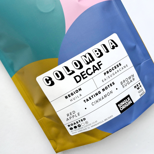 Picture of coffee bag that shows it is a decaf coffee from Colombia. It is from the region of Huila. The process of this coffee is EA or sugarcane process. The coffee is roasted medium.